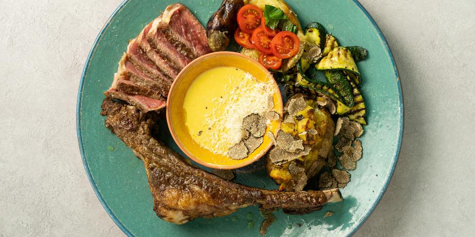 Tomahawk Steak with Truffle Baked Potatoes and Charcoaled Vegetables